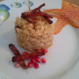 Risotto allo zafferano con speck e melograno